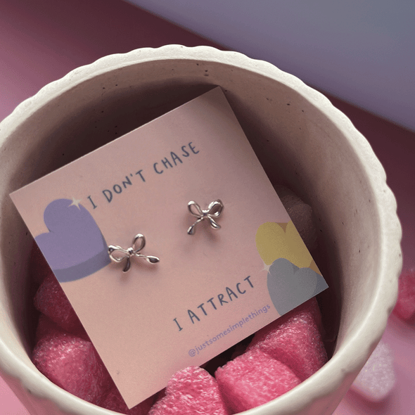 'I attract' mini ribbon ear studs