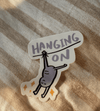 Hanging on sticker
